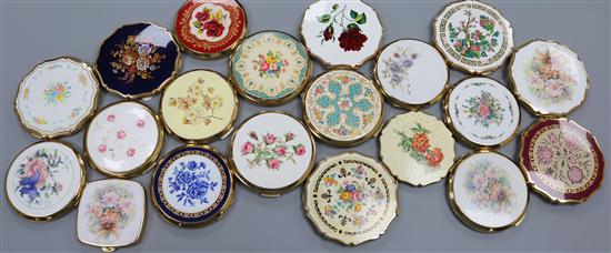 A collection of vintage Stratton powder compacts, including one Indian Tree design,